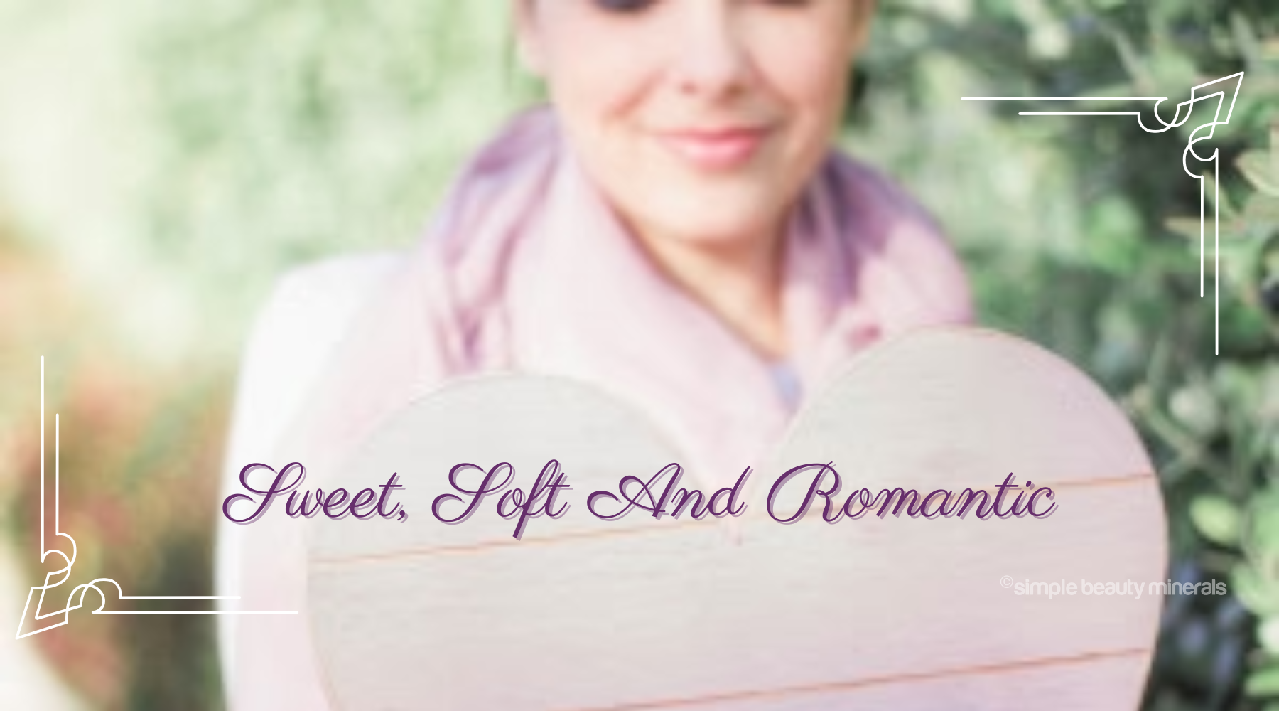 smiling woman holding a heart.