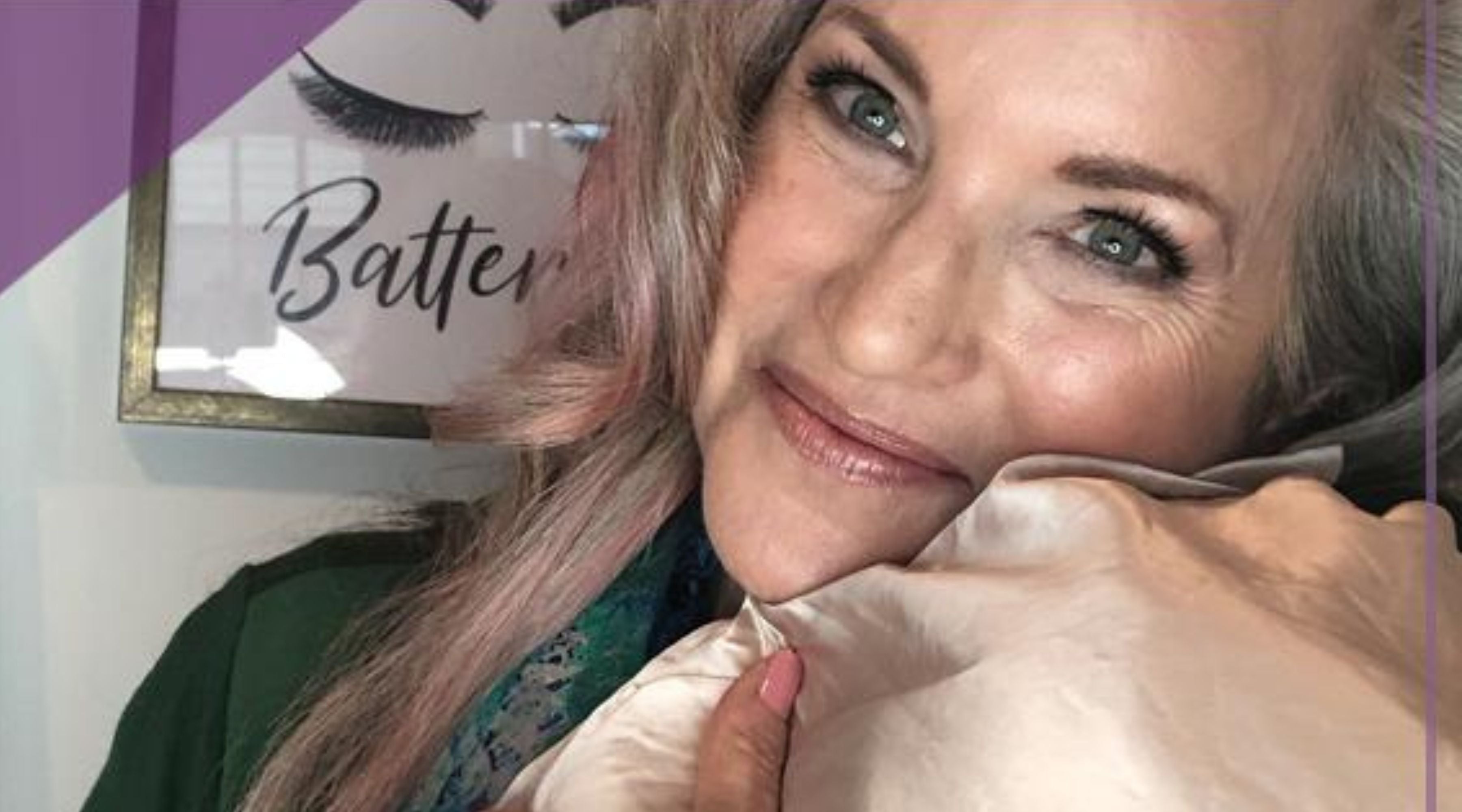 woman with silk pillowcase and smiling.