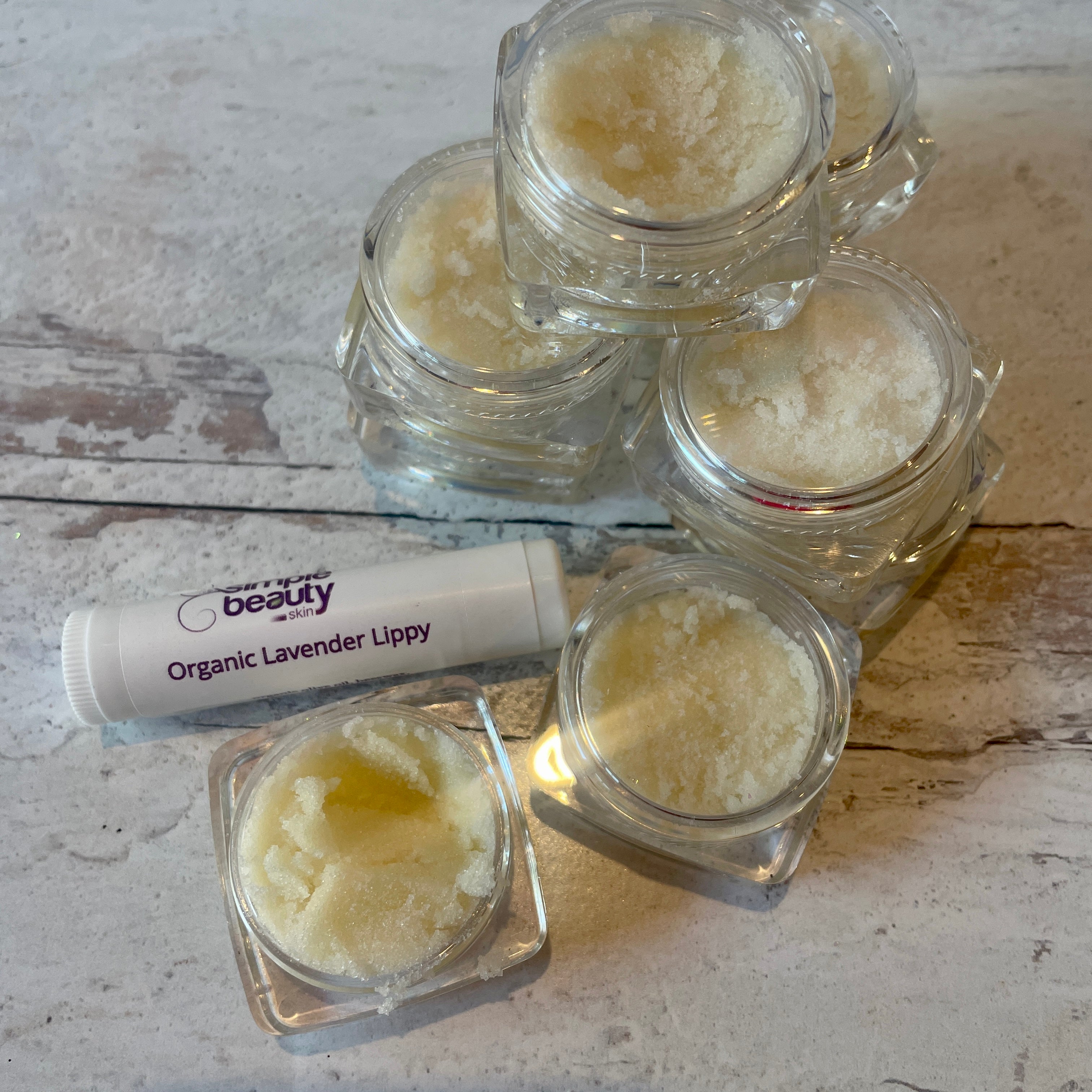 jars of lip scrub with lip balm.