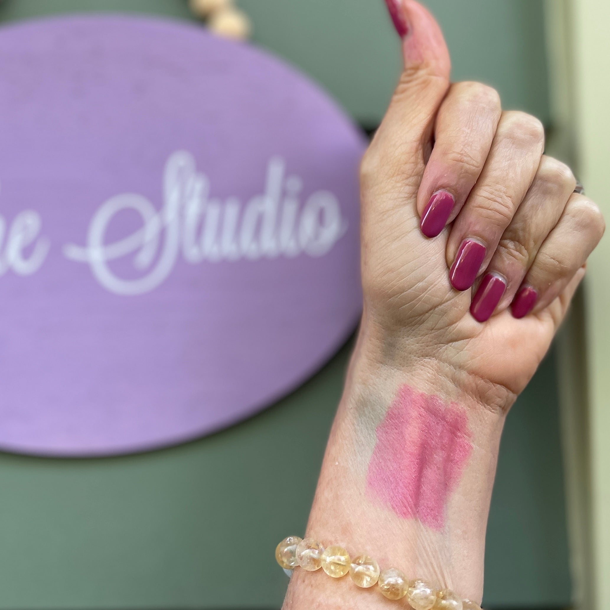 blush lip color swatch on light skin.
