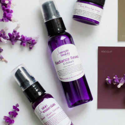 clear skin serum and radiance reveal purple bottles