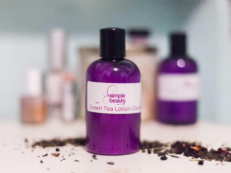 purple cleanser bottle with tea leaves