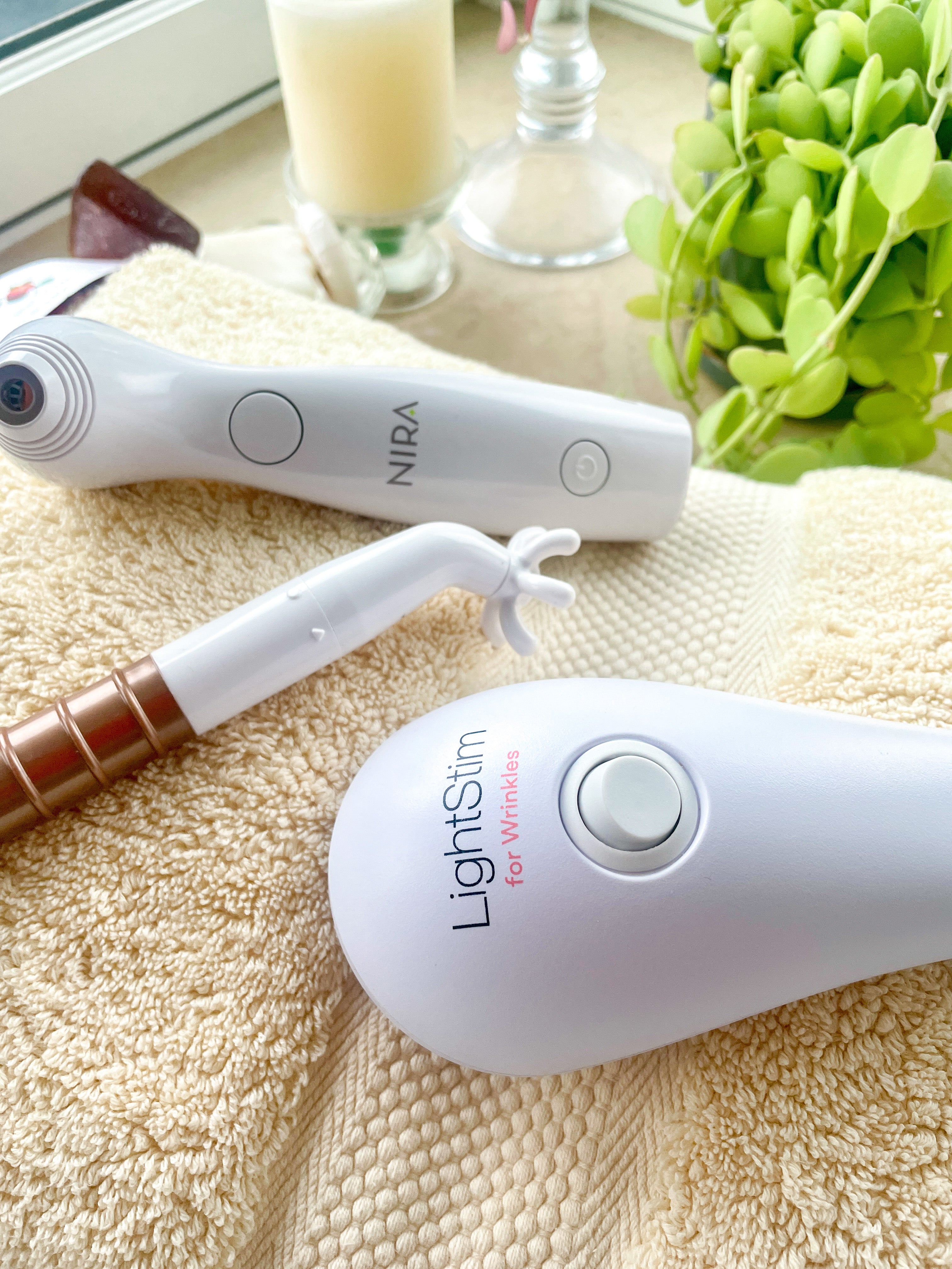 lightstim red light device, nira laser, fascia blaster face on towel