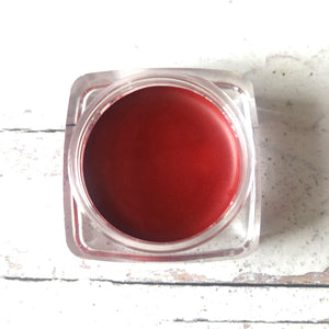 pot of scarlet red mineral lip color