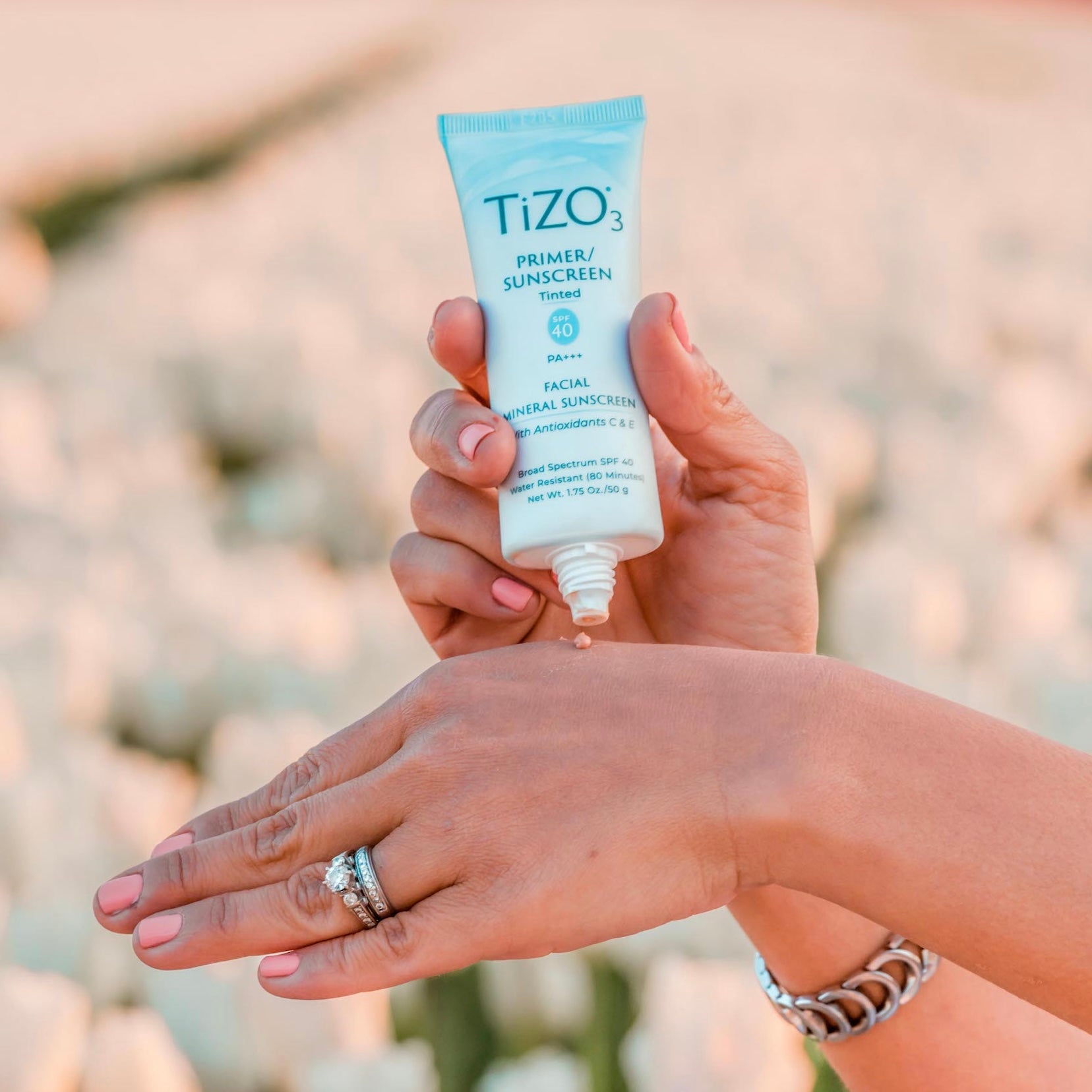 tizo tinted primer sunscreen on hand
