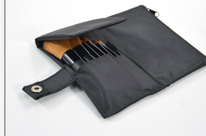 brush set inside black fabric pouch
