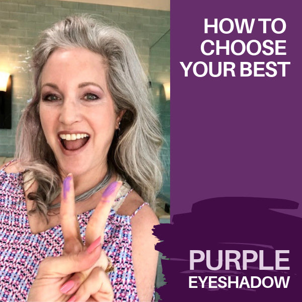 lisa holding up swatches of purple eyeshadows