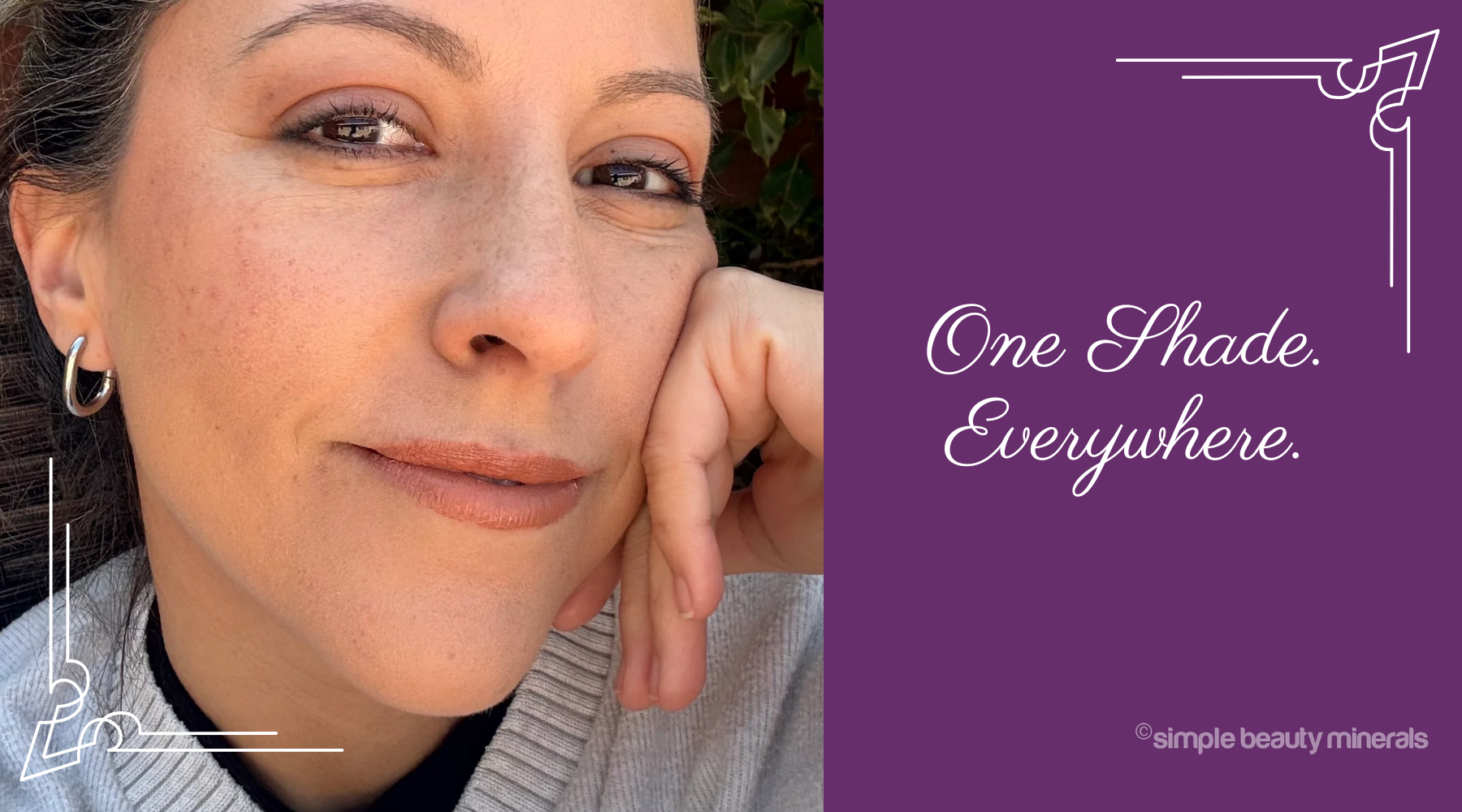 smiling woman wearing makeup.