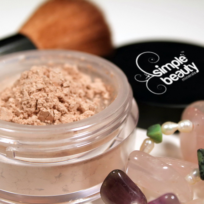 foundation powder with makeup brush and jewels