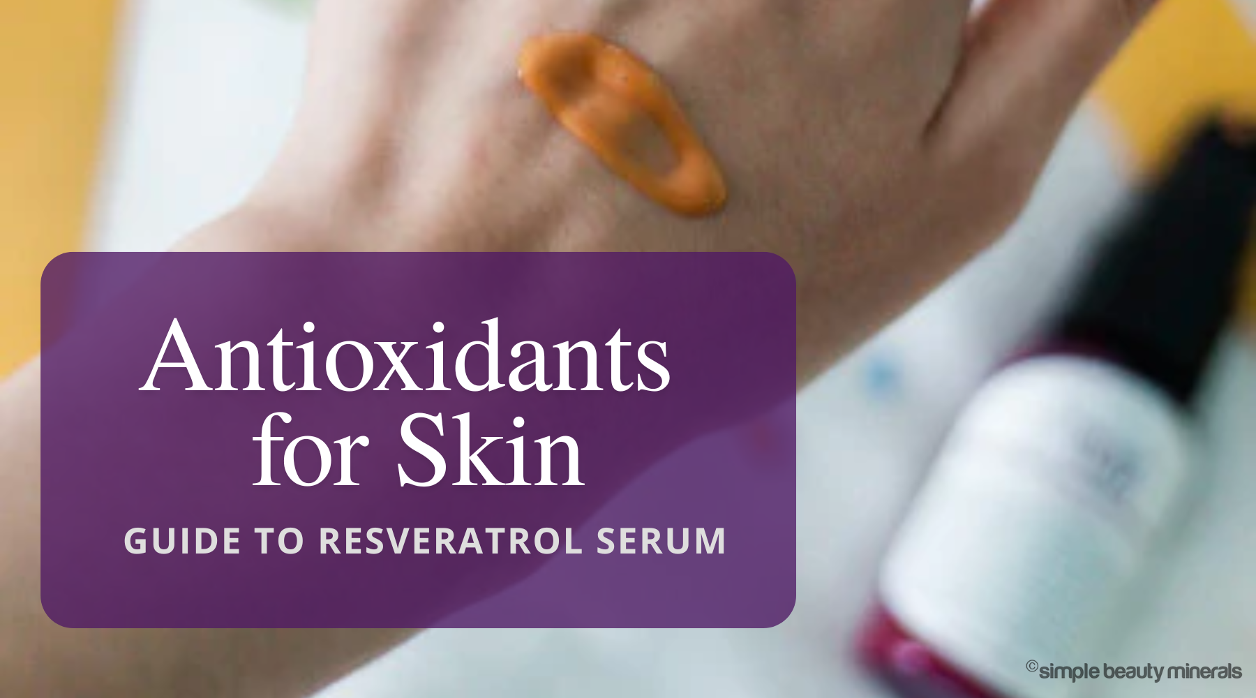 swatch of facial serum on hand of a woman.