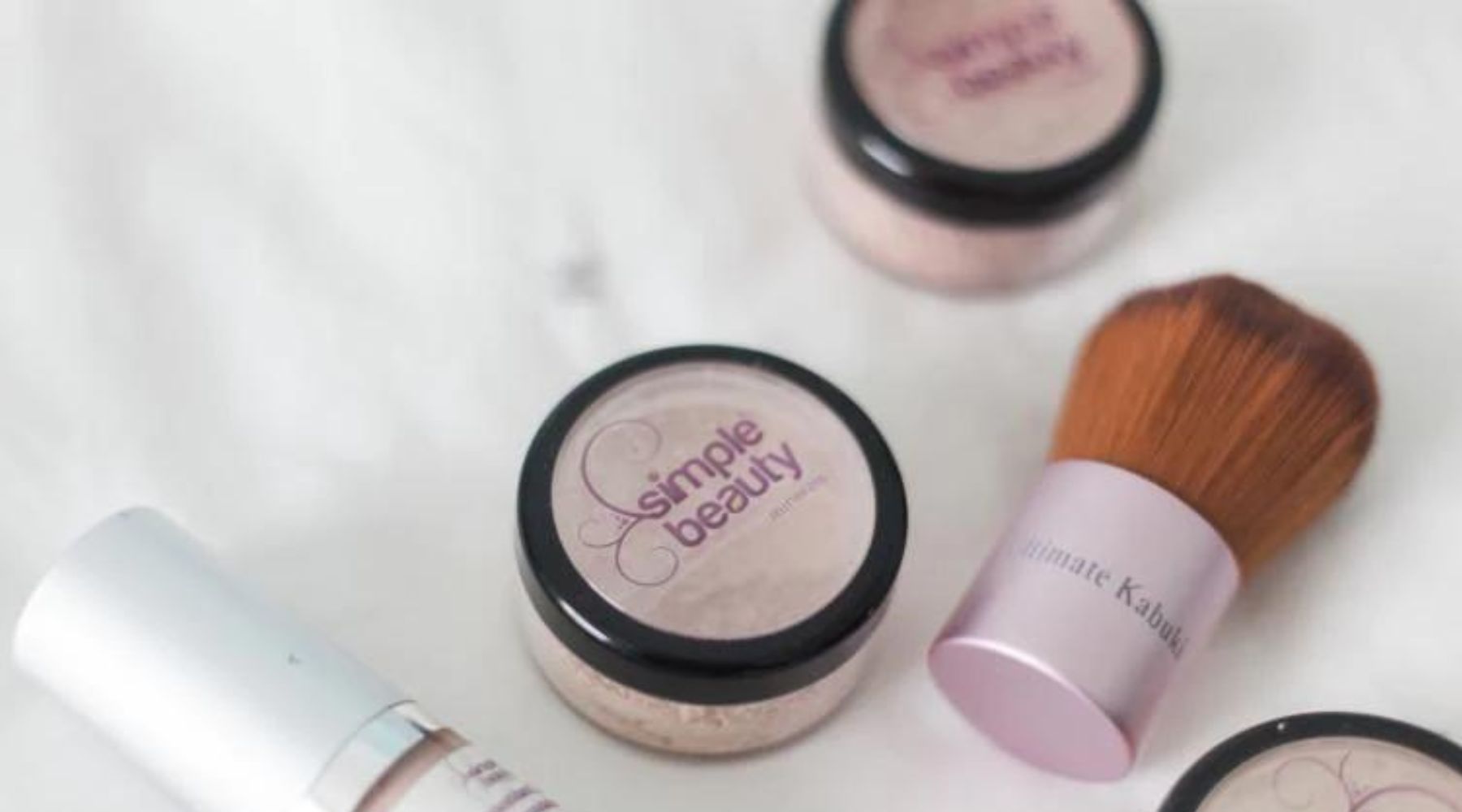 jars of mineral foundation and brush.