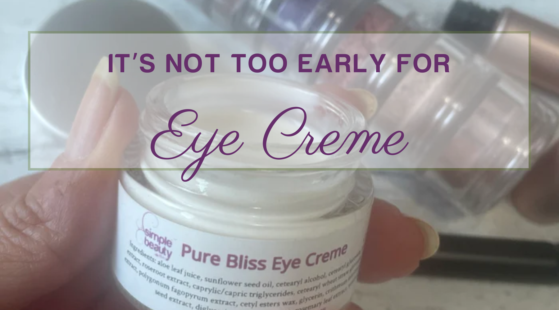 woman's hand holding an open jar of eye creme.