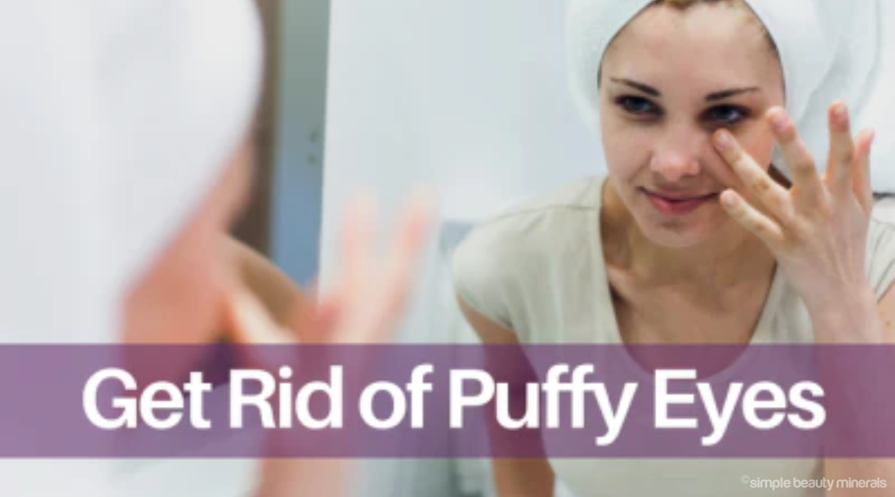 woman gently patting eye area while looking into mirror. 