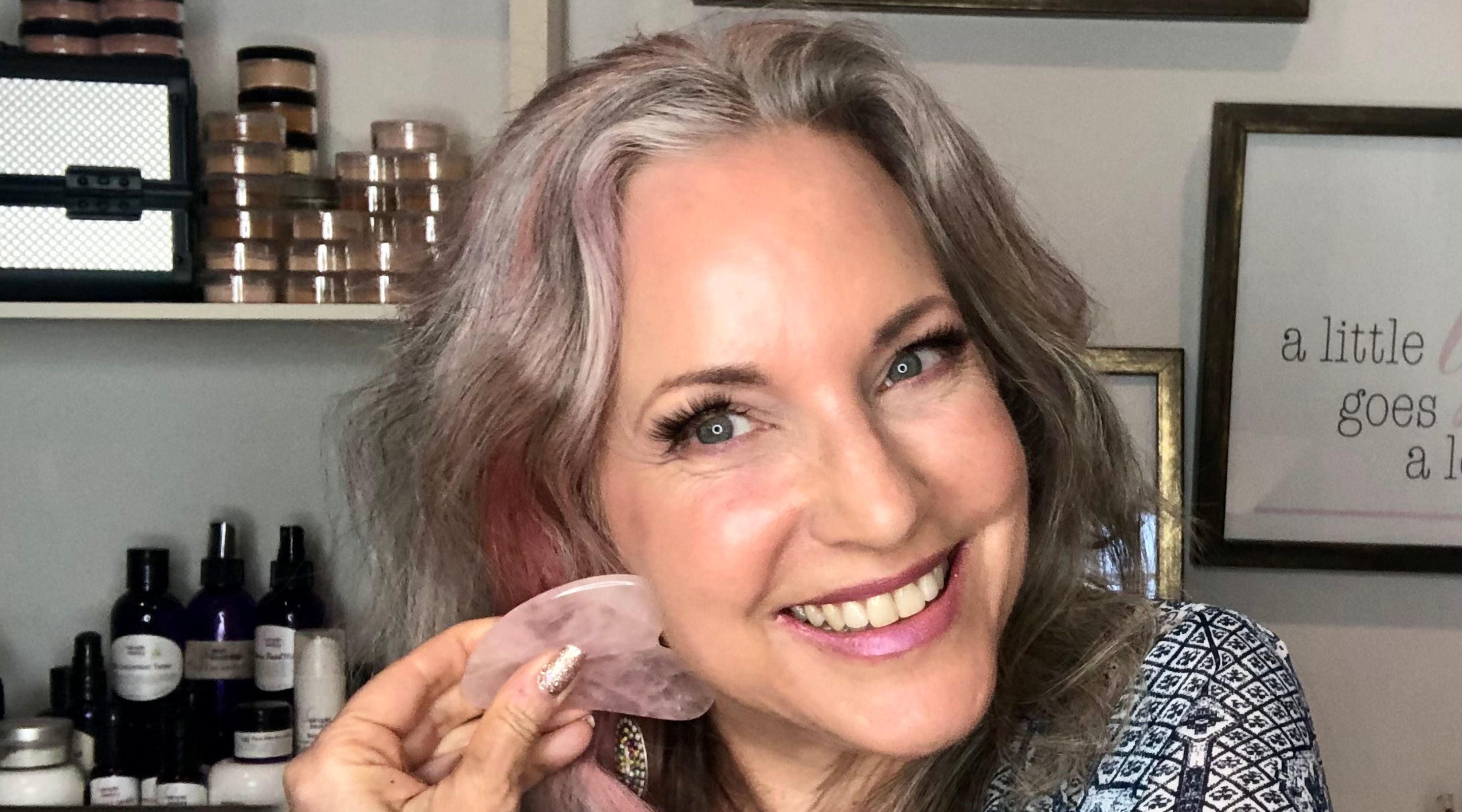 woman with gua sha on face.