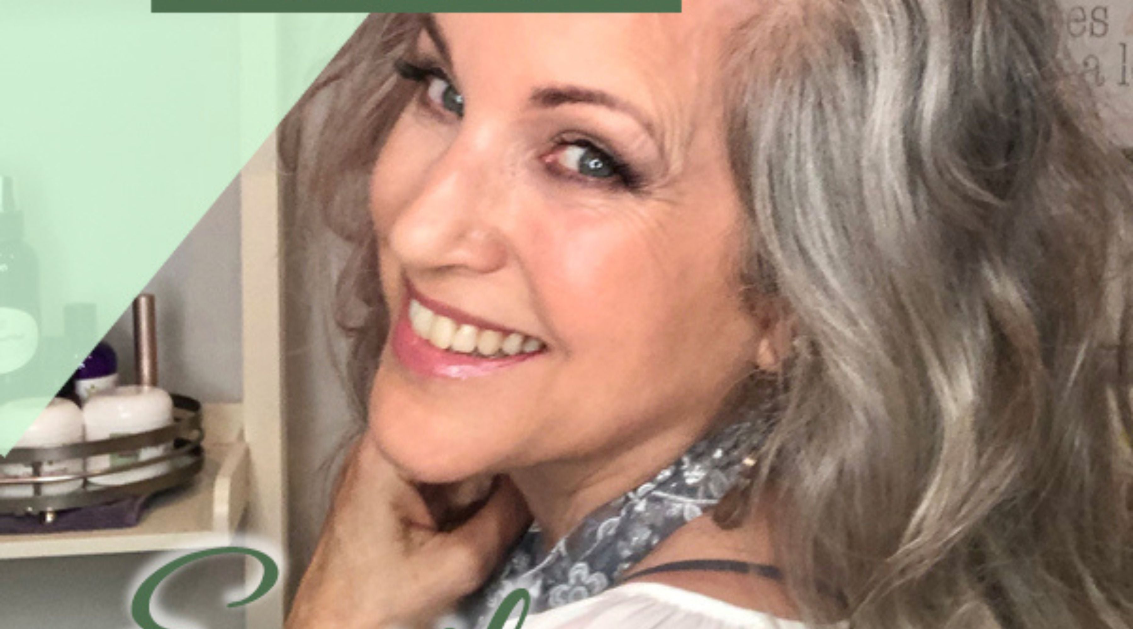 mature woman smiling at camera.