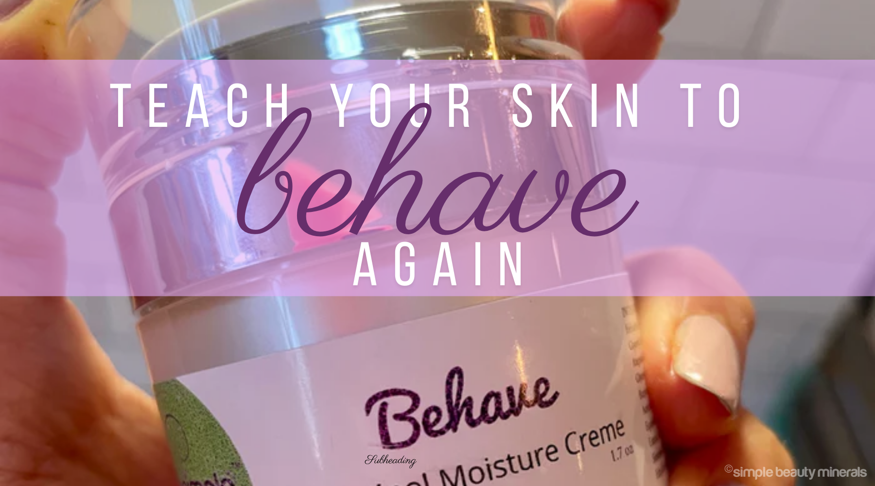 Hand holding a bottle of retinol creme.