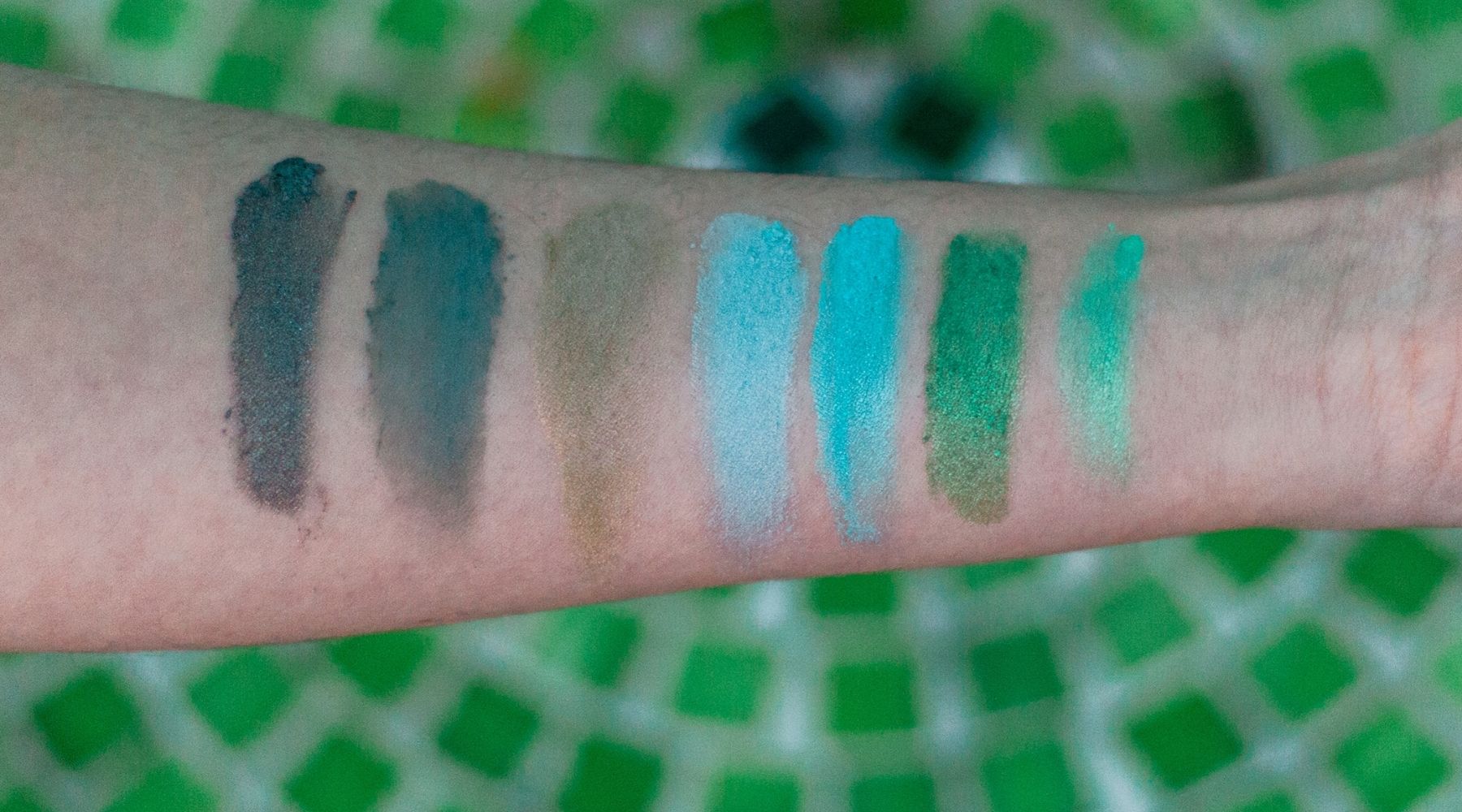 green eyeshadow swatches on arm