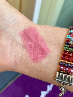 blush lipstick crayon swatch on medium skin