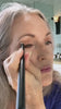 owner of simple beauty minerals applying eye makeup with crease brush