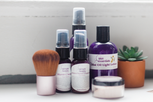 skin care grouping purple bottles with cactus plant