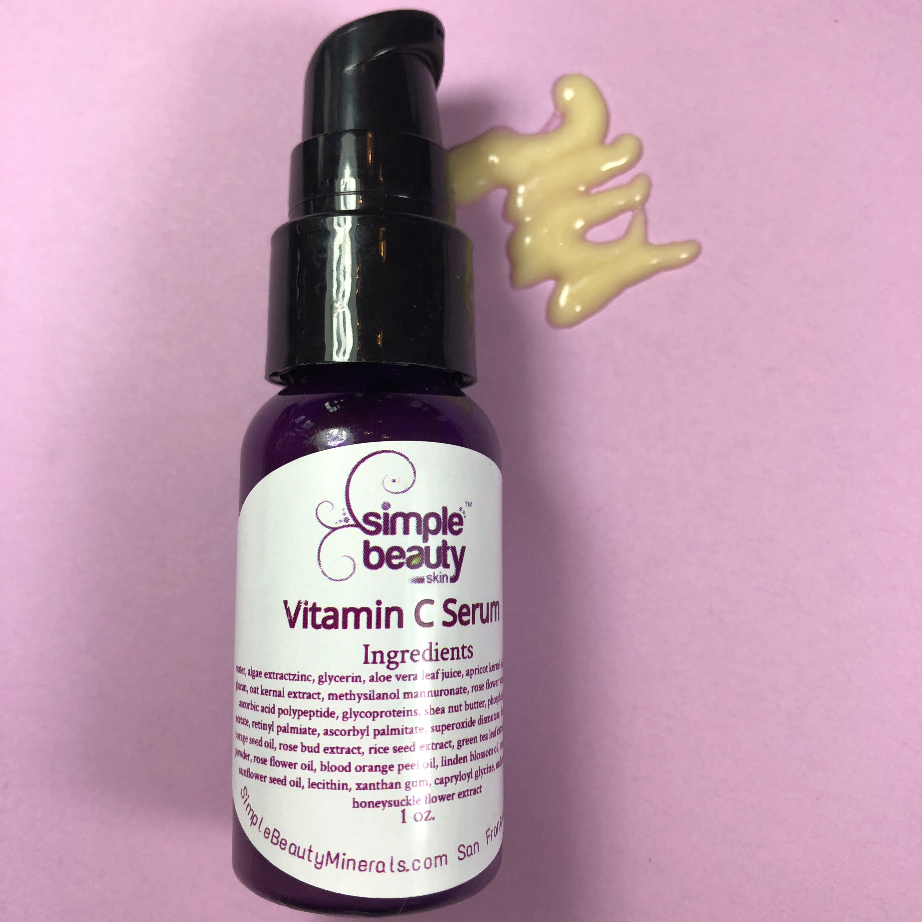 vitamin c serum squirt on purple background