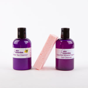 2 purple cleansers with pink bar in the middle
