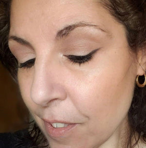 woman wearing soft touch eyeshadow and black wing liner